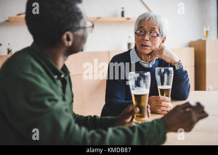 senior friends drinking beer Stock Photo