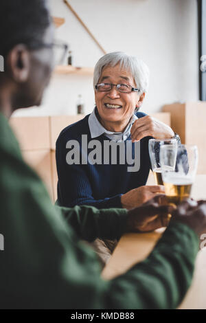 senior friends drinking beer Stock Photo