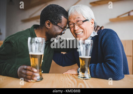 senior friends drinking beer Stock Photo