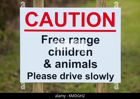 CAUTION Free range children and animals, Please drive slowly sign in the Oxfordshire countryside. England Stock Photo