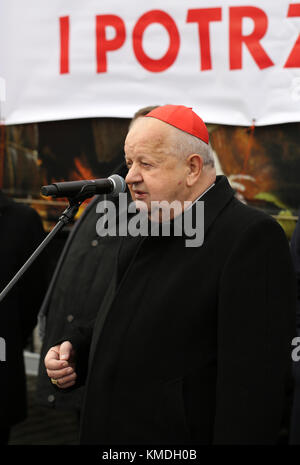 CRACOW, POLAND - DECEMBER 20, 2015:  Cardinal Stanislaw Dziwisz during Christmas Eve for poor and homeless on the Central Market in Cracow. Stock Photo