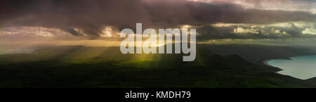 Crepuscular rays over the Llyn peninsular, Wales Stock Photo