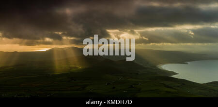 Crepuscular rays over the Llyn peninsular, Wales Stock Photo