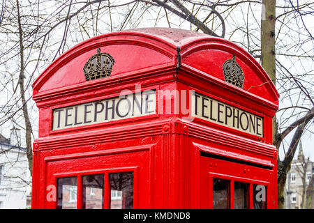 Traditional red British K2 telephone box, designed by Sir Giles Gilbert Scott, in South Grove, Highgate Village, London, UK Stock Photo