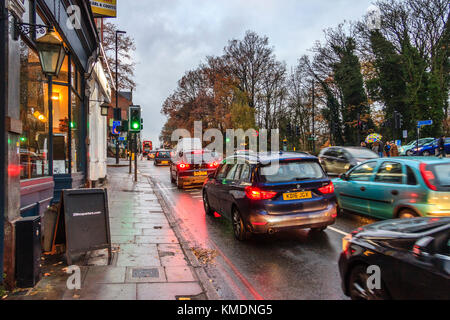 Northbound traffic moving slowly on Archway Road at Highgate, London, UK, on a rainy Sunday evening in December Stock Photo