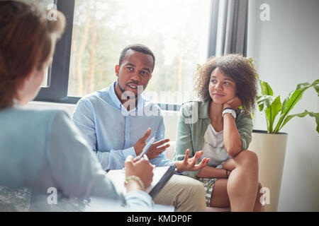 Couple talking to therapist in couples therapy session Stock Photo