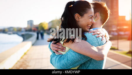 Friends fitness training together outdoors living active healthy Stock Photo