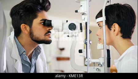 optometrist checking patient eyesight and vision correction Stock Photo