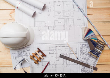 Architecture drawing desk, construction site working with blueprints in the office top view Stock Photo
