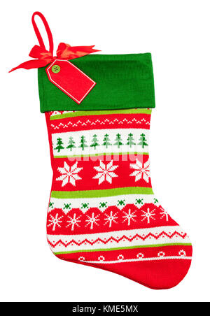 Knitted Christmas Stocking with Snow Flake and Tree Designs Isolated on a White Background. Stock Photo