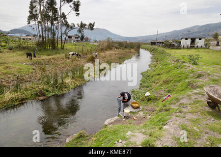 Ecuador South America - village scene, northern Ecuador, indigenous woman washing clothes in a river, Ecuador, South America Stock Photo