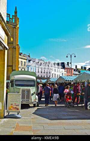Cirencester Market Place, Gloucestershire, England on a busy Saturday. The old French Citroen HY van is converted to use as a coffee stall. Stock Photo