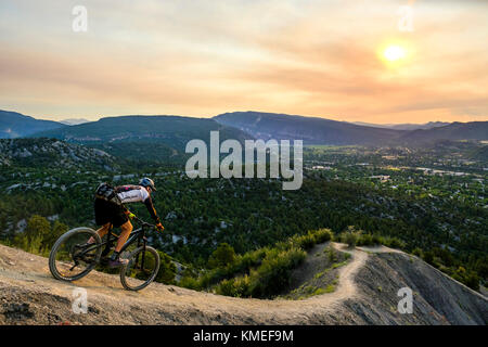 Male Mountain Biker in scenic landscape rides down Hogs back near Durango,Colorado Stock Photo