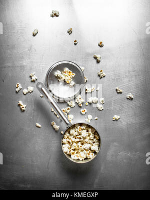 Popcorn in the pot. On the metal table. Stock Photo