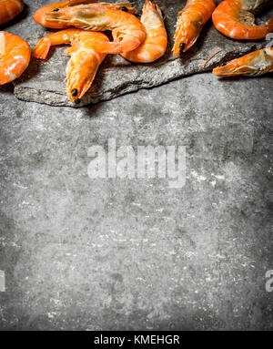 Boiled big red shrimp on a background white Stock Photo - Alamy