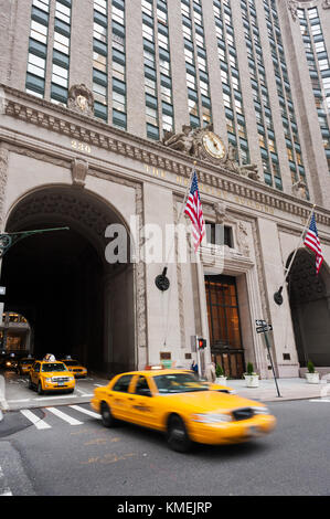 New York, USA - Nov 15, 2011 : Yellow taxis passing by the Helmsley building in New York City Stock Photo