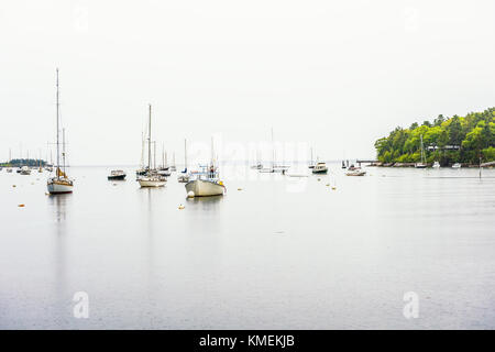 Rockport, USA - June 9, 2017: Empty marina harbor in small village in Maine during rain with boats Stock Photo