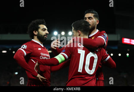 Liverpool's Philippe Coutinho (centre) celebrates scoring his side's second goal of the game during the UEFA Champions League, Group E match at Anfield, Liverpool. Stock Photo