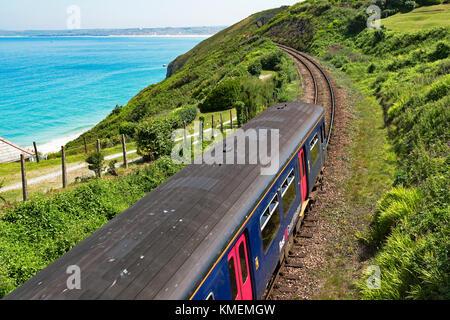 train on the st.ives coast line at carbis bay near st.ives in cornwall, england, britain, uk. Stock Photo