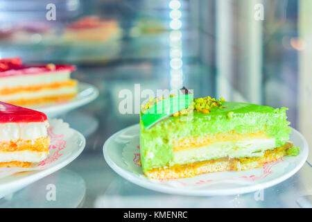 Pistachio dessert in the fridge on display at the cafe in Positano town, Amalfi coast, Italy Stock Photo