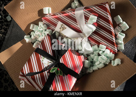 Wrapped Christmas Presents in Packing Box, USA Stock Photo