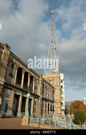 Iconic TV mast/ antenna, Alexandra Palace, site of first regular public television service (BBC), in sunshine, against blue skies and light clouds. UK Stock Photo