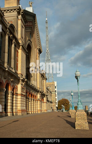 Historic Alexandra Palace, west wing and entrance to the Palm Court with glass dome, North London UK, in the afternnon sun with blue skies/ light clou Stock Photo