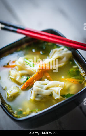 Wonton Soup On Wooden Background Stock Photo