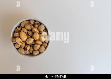 Bowl with Bronte's Pistachio seasoned isolated on a white background Stock Photo
