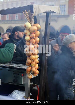 CRACOW, POLAND - DECEMBER 20, 2015:  Christmas Eve for poor and homeless on the Central Market in Cracow. Every year the group Kosciuszko prepares the Stock Photo