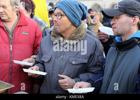 CRACOW, POLAND - DECEMBER 20, 2015:  Christmas Eve for poor and homeless on the Central Market in Cracow. Every year the group Kosciuszko prepares the Stock Photo