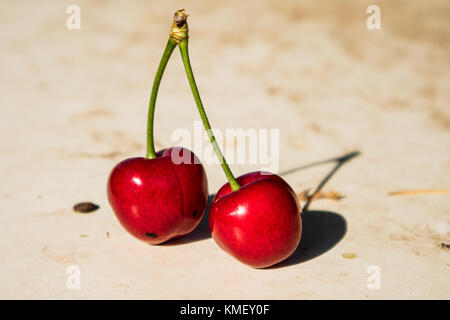 Juicy red cherries on a light background Stock Photo