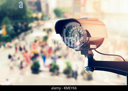 cctv security camera over the city street Stock Photo