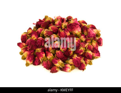 Heap of dry rosebuds for rose tea isolated on white background Stock Photo