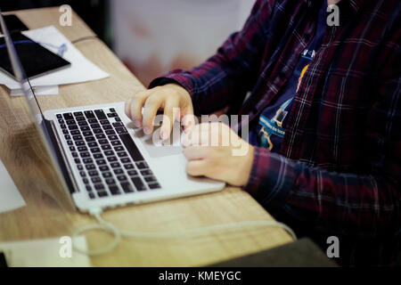 Man uses laptop for coding software Stock Photo