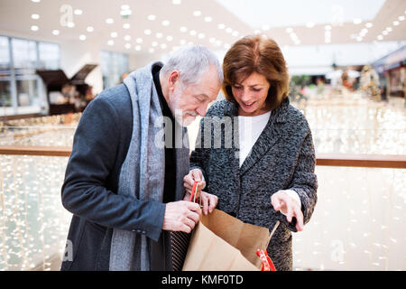 Senior couple doing Christmas shopping. Stock Photo