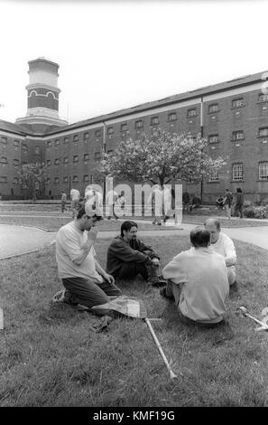 Prison inmates in exercise grounds during association, HMP Winchester, Winchester, Hampshire, United Kingdom. 10 May 2001. Stock Photo