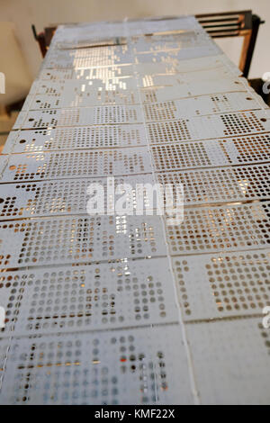 Looking up the line of punch cards of a 19th century Jacquard Textile Loom Stock Photo
