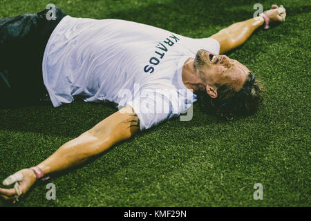 Exhausted athlete lying on grass,Tenerife,Canary Islands,Spain Stock Photo