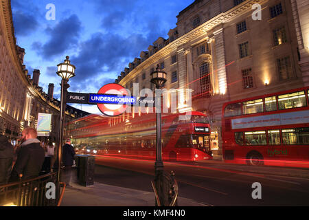 Red buses on Regent Street at dusk, by Piccadilly Circus, in central London, England, UK Stock Photo