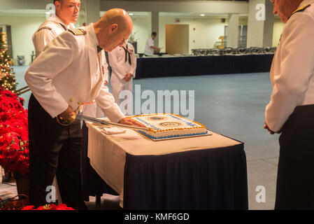 U.S. Navy Capt. Stephen Lee cuts the ceremonial birthday cake during the Chaplain Corps’ 242nd anniversary celebration, Joint Base Pearl Harbor-Hickam, Dec. 2, 2014. The event featured Rear Adm. Brent Scott, the Chaplain of the Marine Corps, as the guest speaker, and celebrated the Chaplain Corps’ storied history with dinner, music, and traditional Hawaiian dance performances. The celebration also highlighted the important role chaplains play in the emotional and spiritual resiliency of Marines, both forward deployed and in garrison.