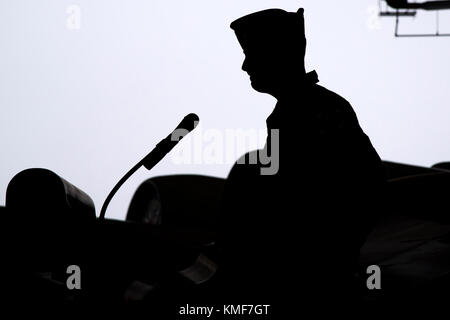 Lt. Col. Brandon Kelly, incoming 76th Fighter Squadron commander, addresses attendees during an Assumption of Command ceremony, Dec. 3,2017, at Moody Air Force Base, Ga. An Assumption of Command is a military tradition that represents a formal assumption of a unit’s authority and responsibility by a commander. Stock Photo