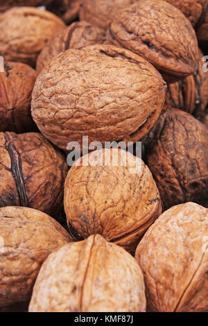 Walnut texture. Brown big walnuts as background. walnut nuts pattern close up photo. Stock Photo