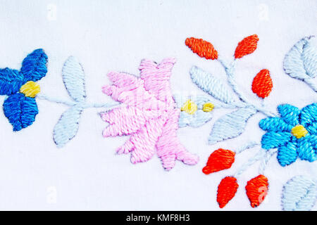 Embroidery background. Floral handwork hobby closeup photo. Stock Photo