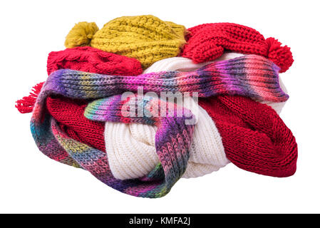 Warm winter clothes. Caps and scarves. Stock Photo