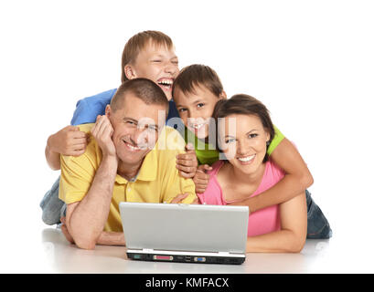 Parents with sons using laptop Stock Photo