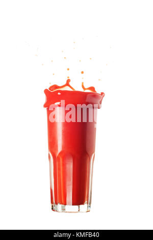 Tomato juice splash out from a glass isolated on white Stock Photo