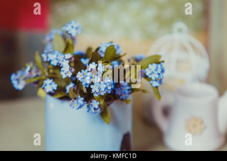 Forget-me-not in rustic cup  Stock Photo