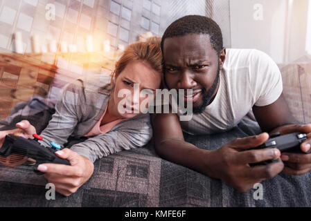Nice young couple resting at home Stock Photo
