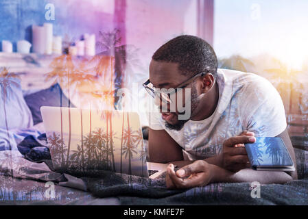 Nice handsome man working at home Stock Photo